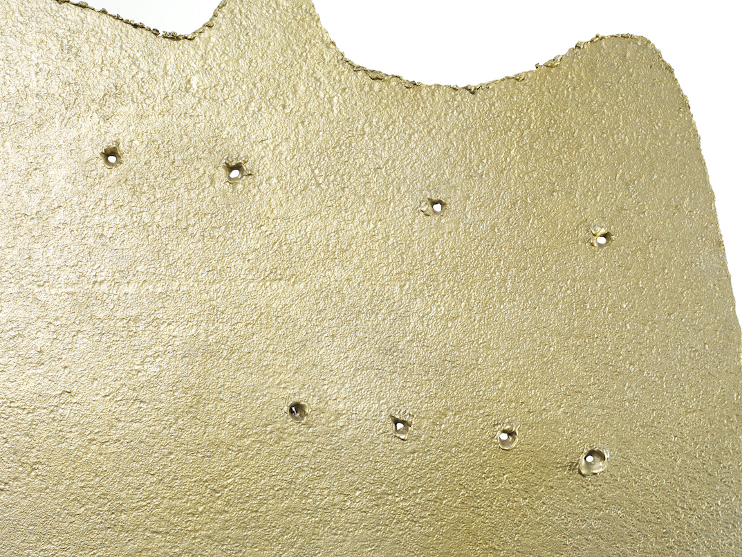 Detail view of Lucio Fontana's sculpture Concetto spaziale, forma