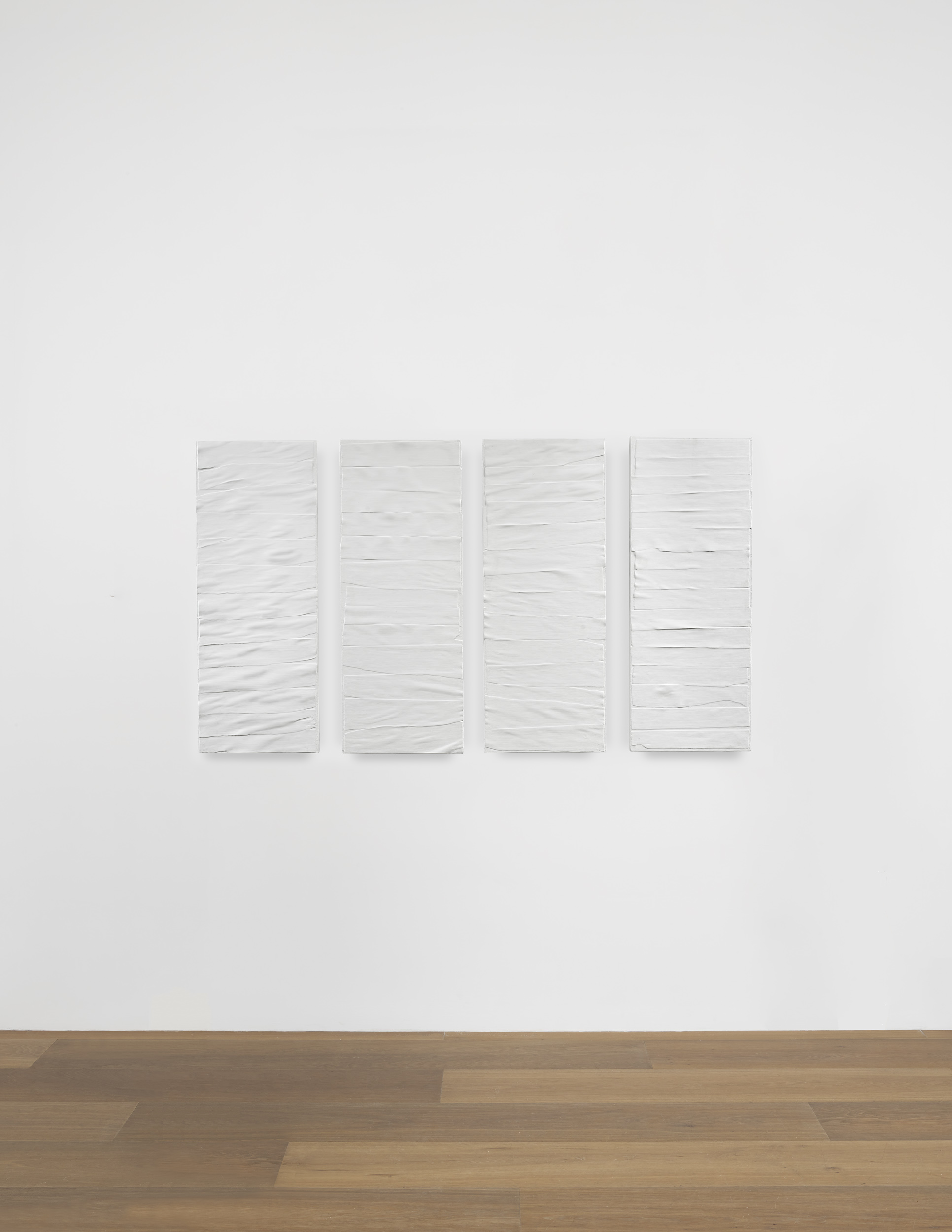 Installation view of Eleanore Mikus's acrylic on wood in four parts work Tablet 142