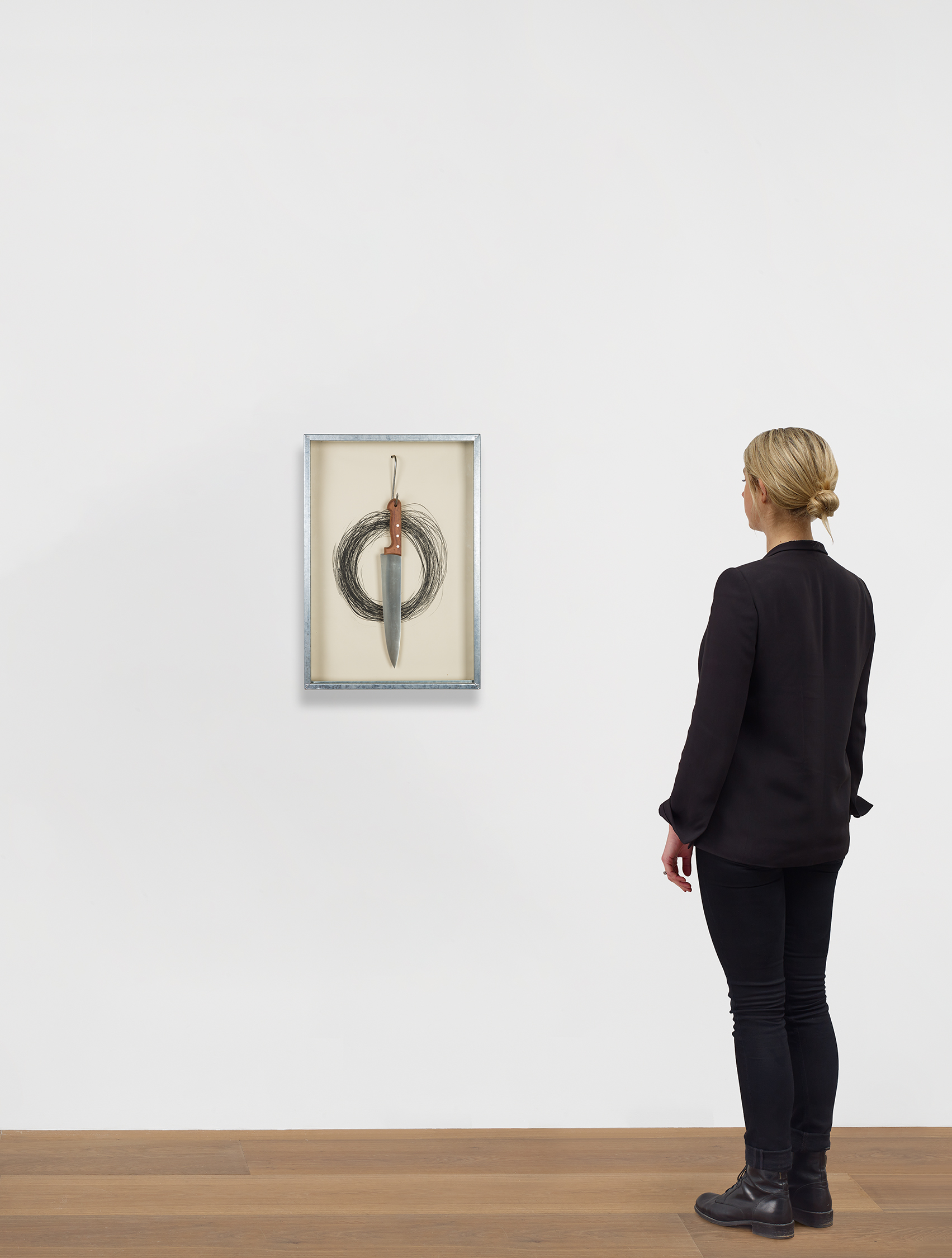 Scale view of Jannis Kounellis's work Untitled (Hanging Knife)