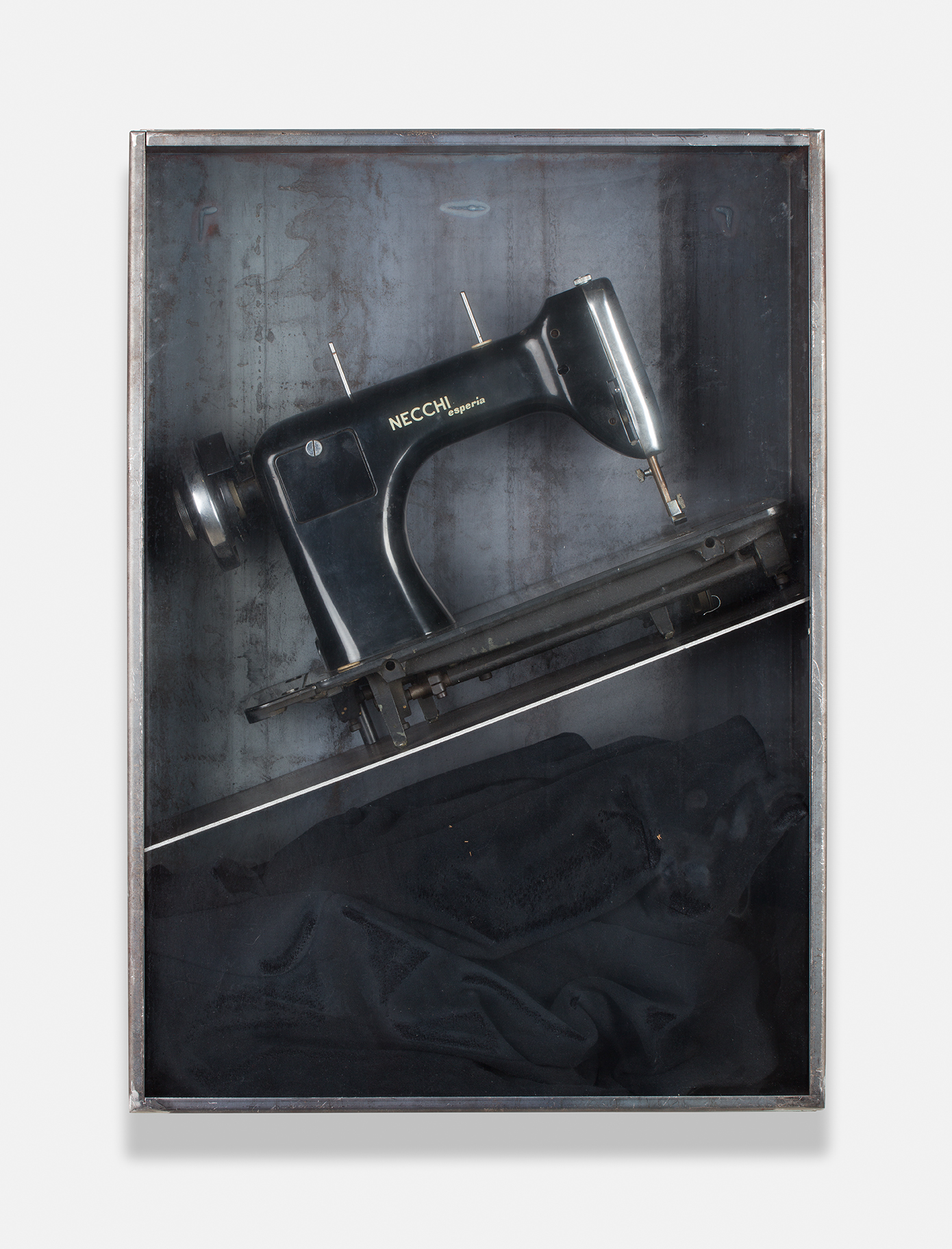 Jannis Kounellis's Metal and glass box with sewing machine and black coat work Untitled (Sewing Machine)