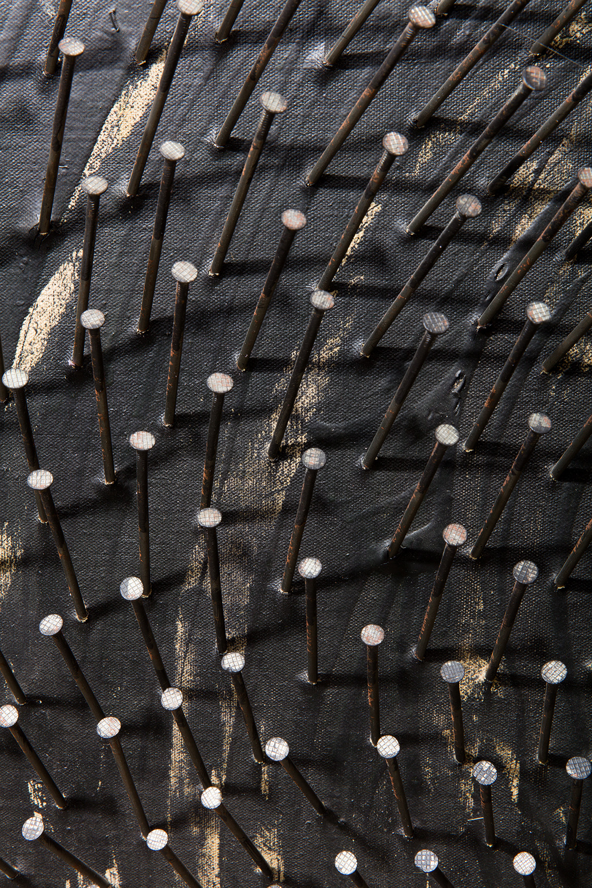 Detail view of Gunther Uecker's nail painting Schwarze Spirale