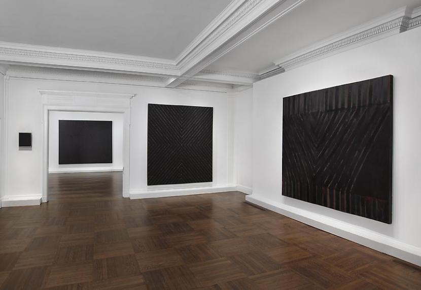 Installation view of Frank Stella's exhibition Black, Aluminum, and Copper Paintings